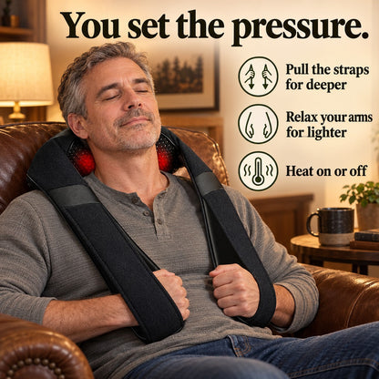 Man in an armchair setting the pressure with the KneadWrap arm straps